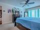 Bright main bedroom featuring a dark wood dresser, ceiling fan, and decor at 1164 E Winged Foot Cir, Winter Springs, FL 32708