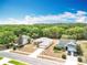 Aerial view showcasing the home's location amongst a canopy of trees at 13546 Biscayne Grove Ln, Grand Island, FL 32735