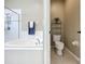 Bathroom with glass enclosed shower, soaking tub and door to the water closet at 13546 Biscayne Grove Ln, Grand Island, FL 32735