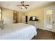 Bedroom with tray ceiling, ceiling fan, wood floors and glass door entry to the screened patio at 13546 Biscayne Grove Ln, Grand Island, FL 32735