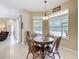 Breakfast nook featuring a round wooden table, chairs, and a 