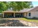 Enjoy the outdoor living with a screened lanai in a spacious backyard at 14421 Pine Cone Trl, Clermont, FL 34711