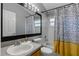 Bathroom featuring a shower-tub combo, patterned shower curtain, and neutral wall color at 14421 Pine Cone Trl, Clermont, FL 34711