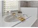 A luxurious bathtub with a wooden tray, perfect for relaxation at 14421 Pine Cone Trl, Clermont, FL 34711