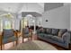Open concept living and dining area with hardwood floors, offering an inviting space for relaxation and entertainment at 14421 Pine Cone Trl, Clermont, FL 34711