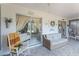 Relaxing enclosed porch featuring wicker furniture, ample seating and sliding doors for indoor/outdoor living at 16 Pine Run, Haines City, FL 33844