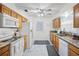 The kitchen boasts wood cabinets, granite countertops, stainless steel appliances, and marble flooring at 16 Pine Run, Haines City, FL 33844