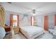 Cozy main bedroom with ceiling fan, marble floors, and neutral walls at 16 Pine Run, Haines City, FL 33844