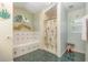 Bathroom with a tub, shower, and green tile at 16730 Beauclaire Ct, Tavares, FL 32778