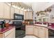 Well-lit kitchen with ample counter space, modern appliances, and plenty of cabinet space at 16730 Beauclaire Ct, Tavares, FL 32778