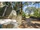 Utility shed with outside storage for yard tools and equipment at 16730 Beauclaire Ct, Tavares, FL 32778