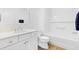 Bathroom featuring modern vanity, toilet, and tiled shower-tub combination at 1674 Cadorette Dr, The Villages, FL 34762