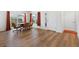 Dining room with hardwood floors with chairs around the wooden table at 1674 Cadorette Dr, The Villages, FL 34762