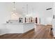 Modern open kitchen features white cabinets, stainless steel appliances, and eat at counter at 1674 Cadorette Dr, The Villages, FL 34762