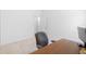 Minimalist office space with desk and chair at 1674 Cadorette Dr, The Villages, FL 34762