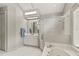 Bright bathroom featuring a glass shower, soaking tub, and white vanity at 17728 Palm View Cir, Mount Dora, FL 32757
