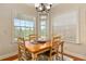Cozy breakfast nook with natural light and wooden table with seating at 17728 Palm View Cir, Mount Dora, FL 32757