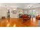 Open game room with pool table, hardwood floors and views to the outdoors at 17728 Palm View Cir, Mount Dora, FL 32757
