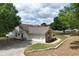 Spacious two-car garage with an adjacent brick accent, offering both functionality and visual appeal to the home's exterior at 17728 Palm View Cir, Mount Dora, FL 32757