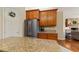Modern kitchen featuring stainless steel appliances and granite countertops at 17728 Palm View Cir, Mount Dora, FL 32757