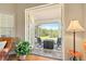 Inviting patio with views of lush greenery at 17728 Palm View Cir, Mount Dora, FL 32757