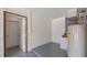 Unfinished basement, utility area with concrete walls and floors and room for storage at 17825 Whisperwind Dr, Clermont, FL 34715