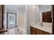 Bathroom with tub and shower, with vanity and pool view through glass door at 17825 Whisperwind Dr, Clermont, FL 34715