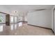 Elegant foyer with neutral tile and hardwood flooring, decorative lighting and a glass double door entrance at 17825 Whisperwind Dr, Clermont, FL 34715