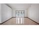 Bright living room with tile flooring, views of the pool area, and white walls at 17825 Whisperwind Dr, Clermont, FL 34715