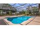 Large screened in lanai with a large pool and room for entertaining at 17825 Whisperwind Dr, Clermont, FL 34715