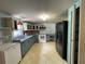 Kitchen featuring blue cabinets, vintage appliances, and lots of counterspace at 1920 Baxter Ave, Orlando, FL 32806