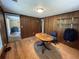 Office featuring wood paneled walls, hardwood floors, a small desk and a window at 1920 Baxter Ave, Orlando, FL 32806
