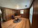 Office space featuring wood paneled walls, hardwood floors and a small desk at 1920 Baxter Ave, Orlando, FL 32806