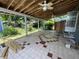 Covered outdoor patio featuring ceiling fans and tile flooring at 1920 Baxter Ave, Orlando, FL 32806