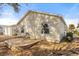 Backyard featuring gravel and a patio with a chair next to the home at 2036 Chesapeake Pl, The Villages, FL 32162