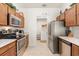 Well-equipped kitchen featuring stainless steel appliances and granite countertops at 2036 Chesapeake Pl, The Villages, FL 32162
