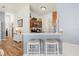 Charming kitchen bar area with granite countertops and seating for two at 2036 Chesapeake Pl, The Villages, FL 32162