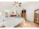 Bright main bedroom with a four-poster bed and en-suite bathroom at 2036 Chesapeake Pl, The Villages, FL 32162