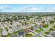 Expansive aerial view showcases the community with lush greenery and serene lakes at 2120 Callaway Dr, The Villages, FL 32162