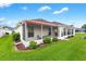 Charming backyard with a screened lanai, well-maintained lawn, and beautiful landscaping at 2120 Callaway Dr, The Villages, FL 32162