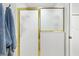 Bathroom featuring a gold-trimmed shower with frosted glass and blue towels hanging on a hook at 2120 Callaway Dr, The Villages, FL 32162