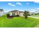 Charming home with a well-manicured lawn, beautiful landscaping, and a welcoming driveway at 2120 Callaway Dr, The Villages, FL 32162