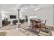 Open layout connects living and dining areas; features modern flooring and bright lighting at 2120 Callaway Dr, The Villages, FL 32162