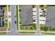 Aerial view of home exterior surrounded by lush landscaping, and neighborhood streets at 2202 Garden Belle Dr, Clermont, FL 34711