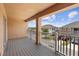 Balcony view showing a neighborhood with well-maintained homes under a beautiful blue sky at 2202 Garden Belle Dr, Clermont, FL 34711