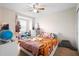 Cozy bedroom with carpet, a ceiling fan, and a window seat at 2202 Garden Belle Dr, Clermont, FL 34711