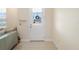 Bright entryway with a glass-paneled front door and a decorative wreath hanging on it at 2202 Garden Belle Dr, Clermont, FL 34711
