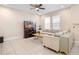 Spacious living room with neutral tones, tile floors, and a cozy seating area at 2202 Garden Belle Dr, Clermont, FL 34711