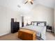 Spacious main bedroom with vaulted ceiling, complemented by neutral paint, and modern fixtures at 2202 Garden Belle Dr, Clermont, FL 34711