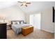 Comfortable main bedroom with a ceiling fan and sliding doors at 2202 Garden Belle Dr, Clermont, FL 34711